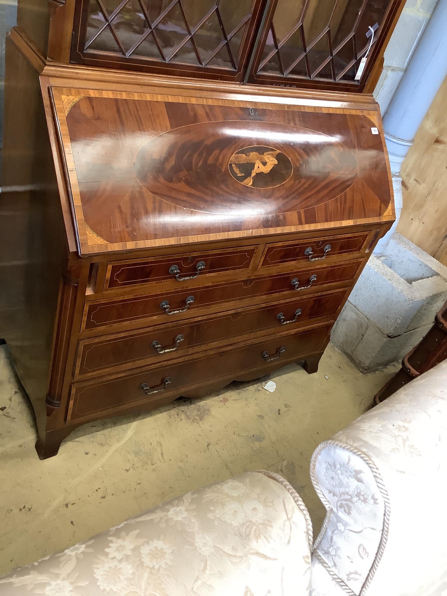 A good quality George III style inlaid and cross banded flamed mahogany bureau bookcase, width 132cm, depth 58cm, height 278cm.